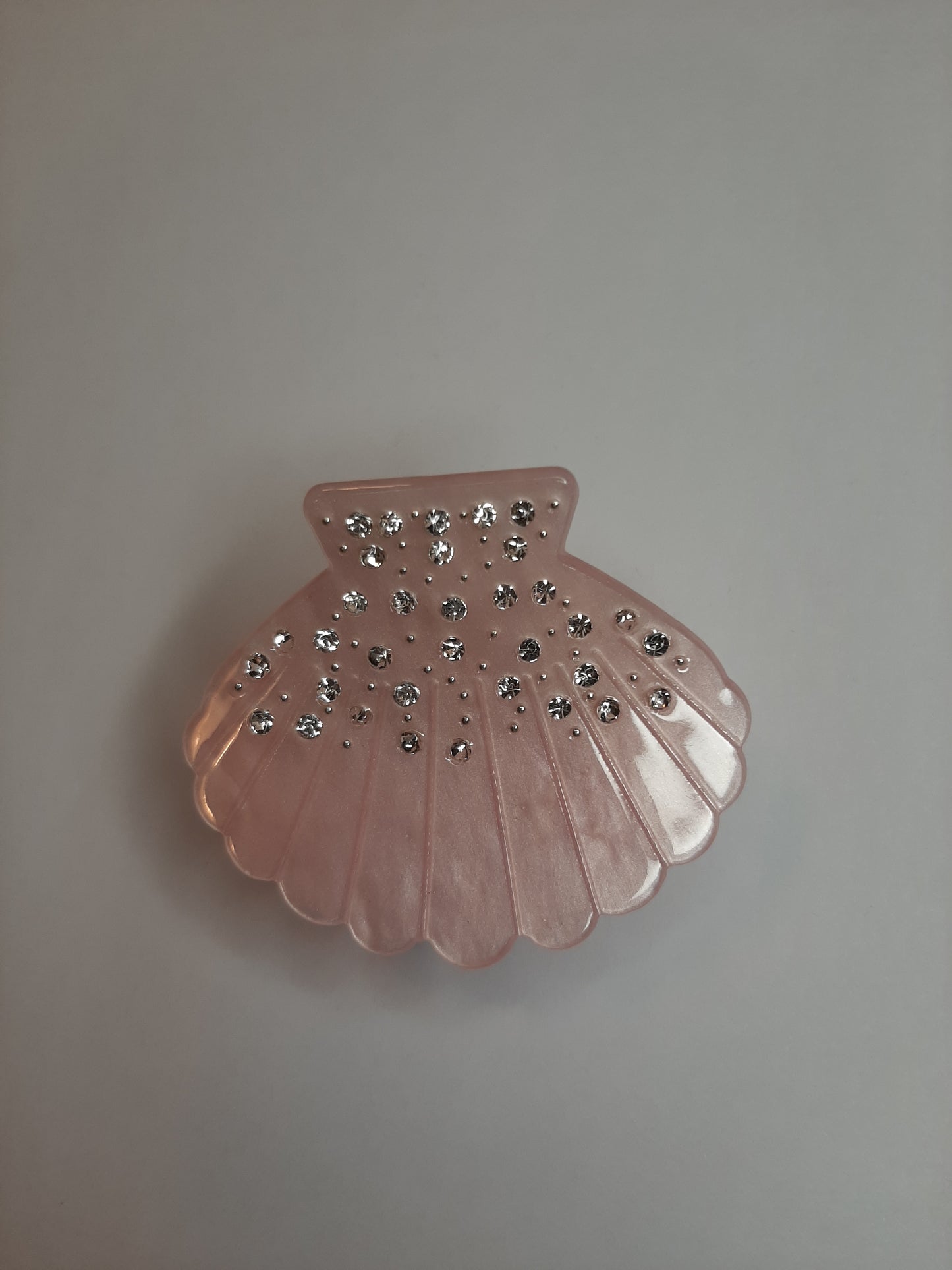 Glitter schelp clip roze